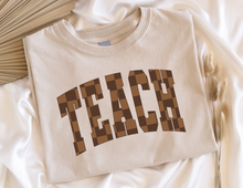 Load image into Gallery viewer, Retro Brown Checkered TEACH Tee